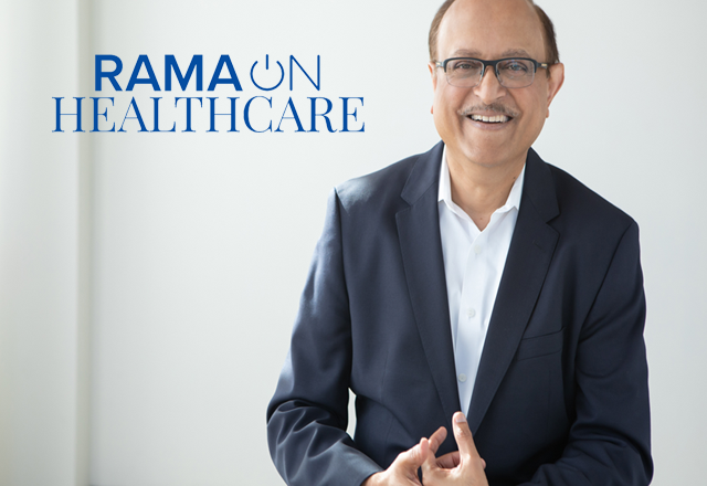 Mohan Nair standing in front of a white background
