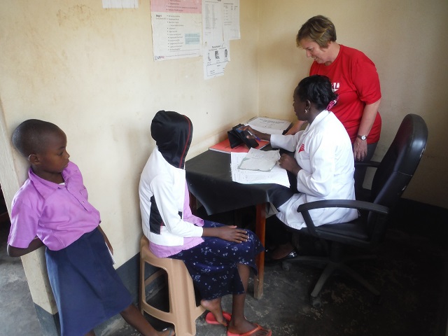 doctor with patients in uganda