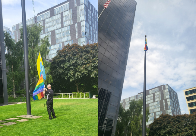 Pride flag flying in front of office building