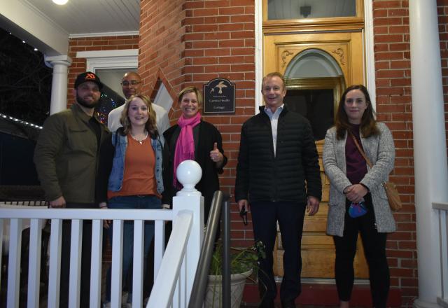 Group of people on the porch of Cambia Cottage