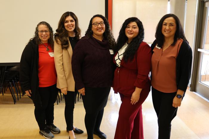 Five women posting for a photo